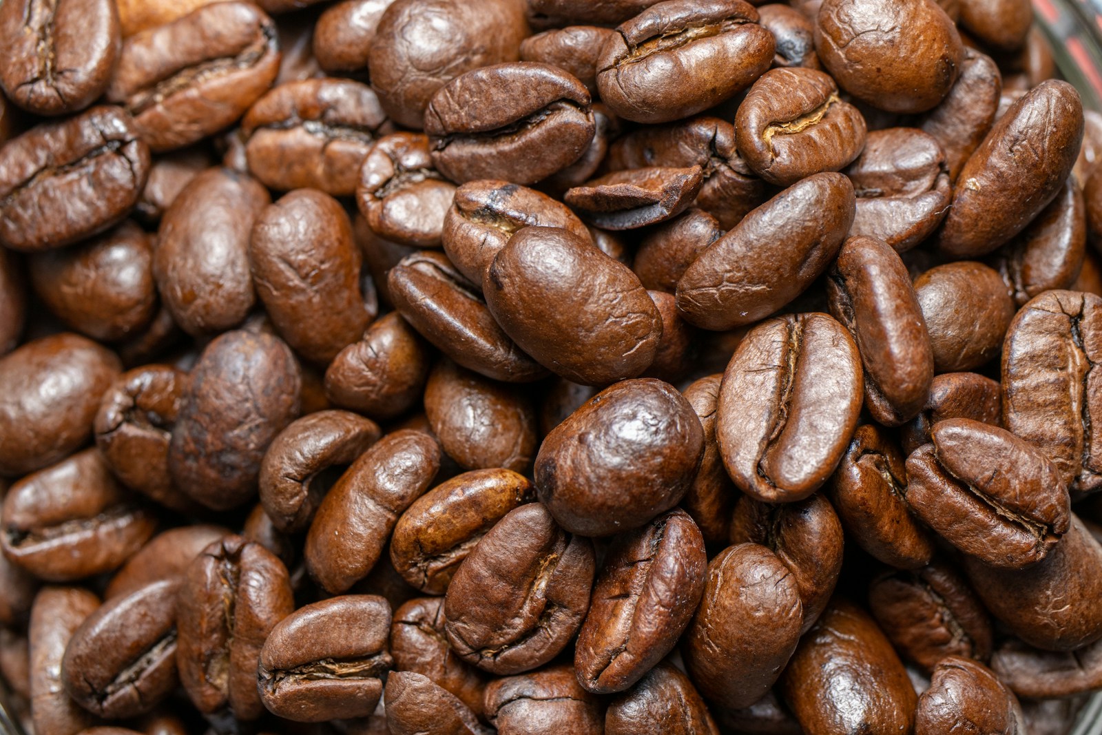 Photo by Andrew Dawes a pile of coffee beans sitting on top of a table